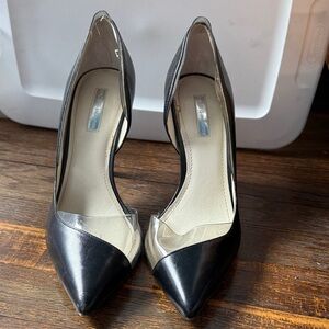 BCBGeneration Black Pointed-Toe Pumps with Clear Vinyl Accent